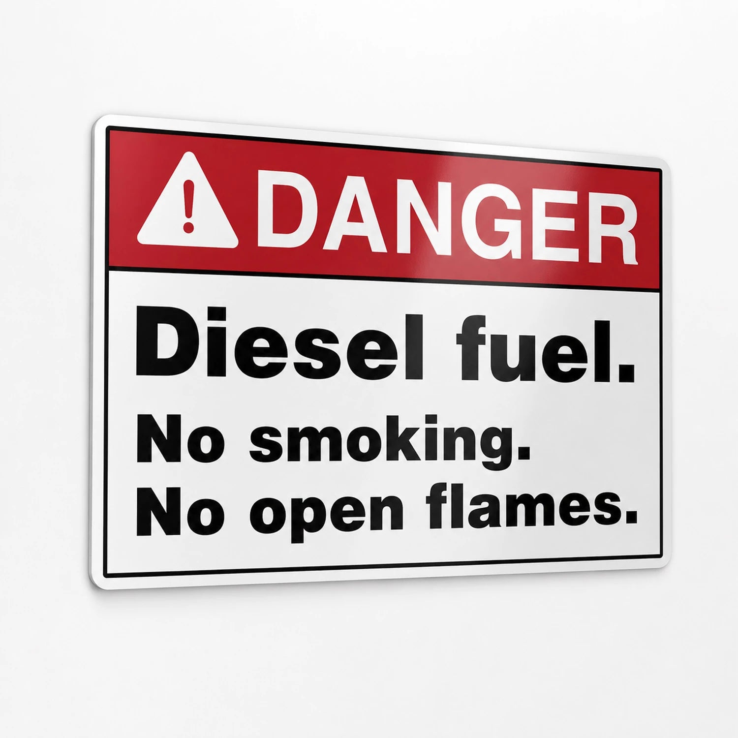 A rectangular warning sign with a red header reading “DANGER” and black text below stating “Diesel fuel. No smoking.