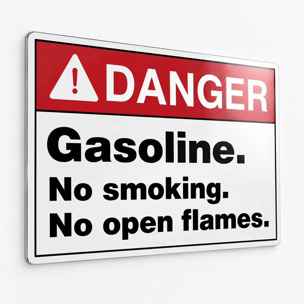 A rectangular warning sign with a red header reading “DANGER” and black text below stating “Gasoline. No smoking.