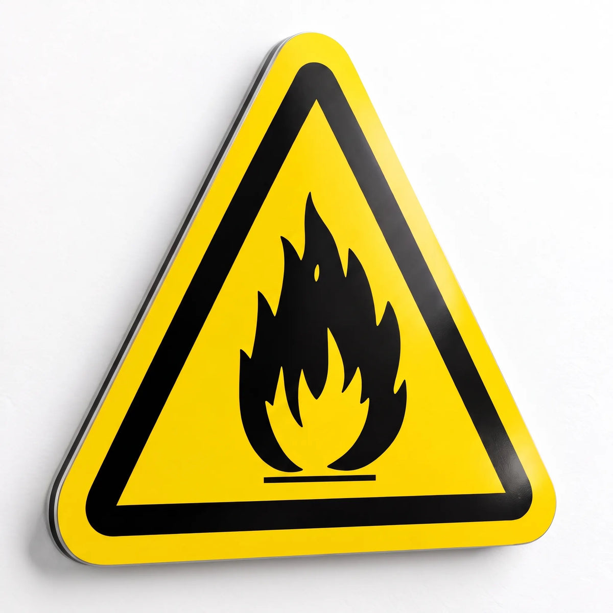 ISO 7010 W021 flammable material warning sign, black flame symbol on yellow triangle with black border