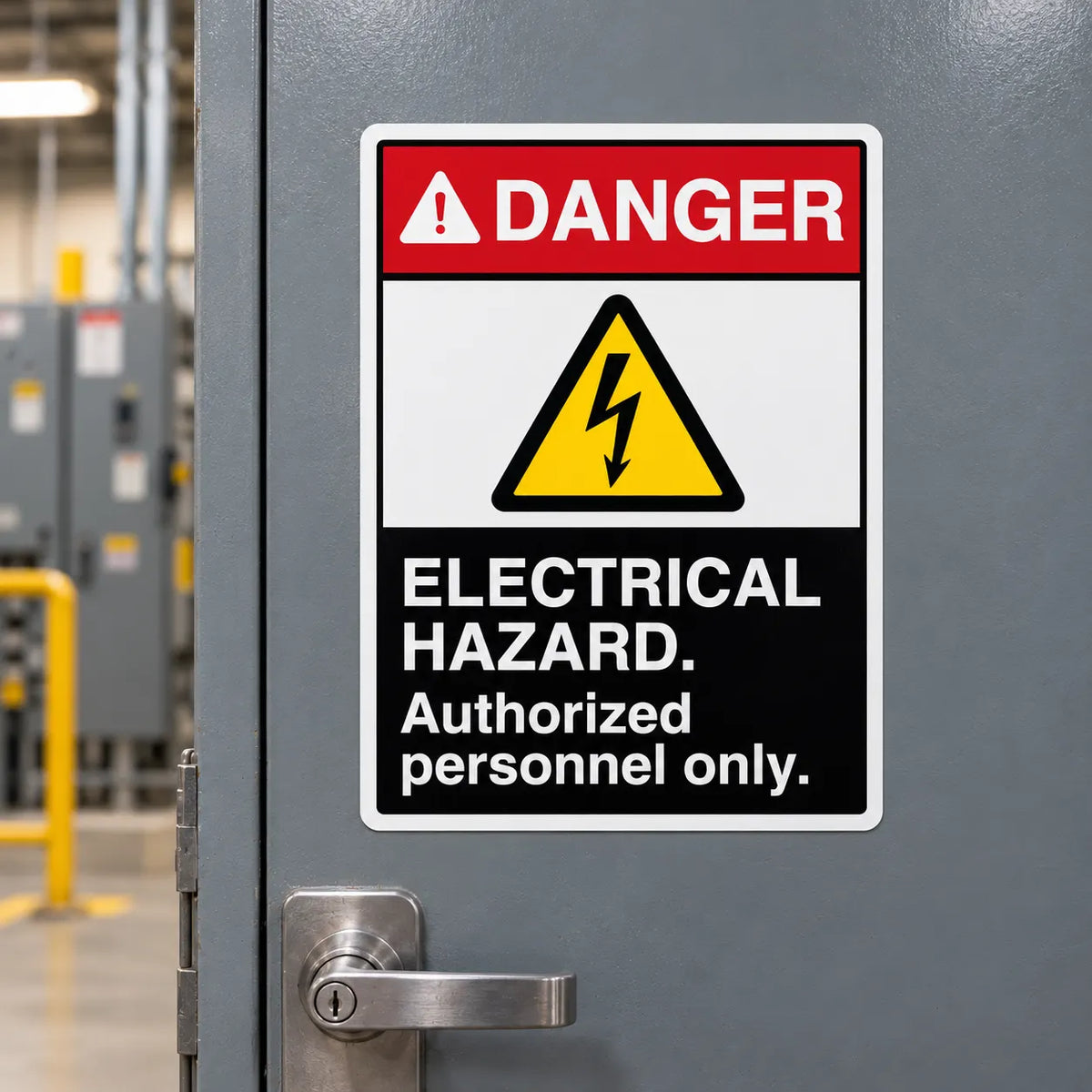 A rectangular electrical hazard warning sign with a red, yellow, and black design, mounted on a gray metal door in an industrial setting.