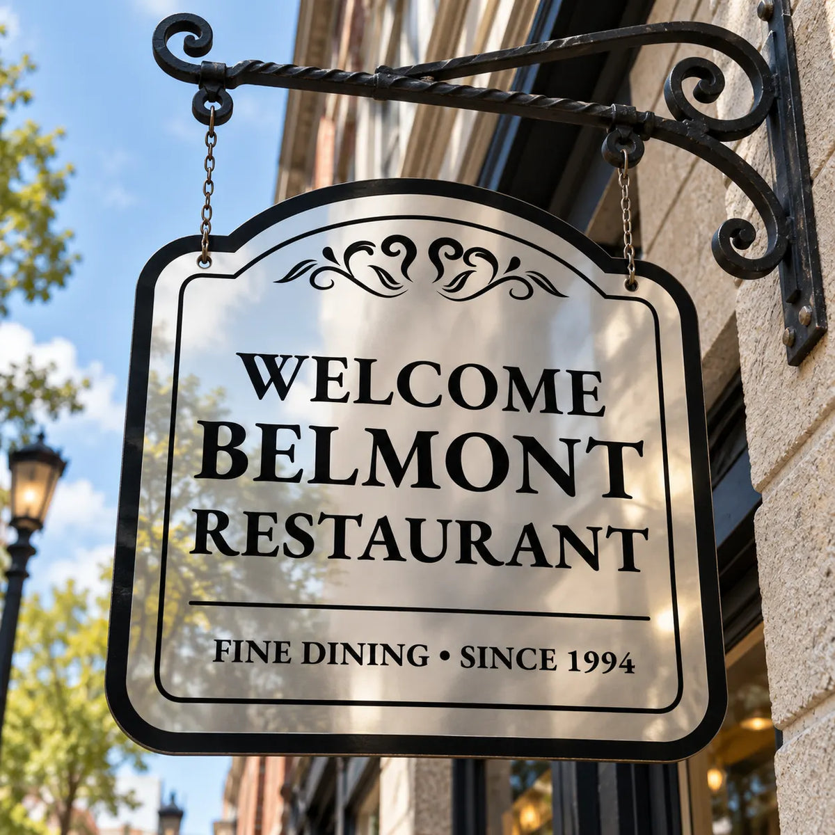 Double-sided arched mirror finish aluminum restaurant sign hanging from a black iron bracket